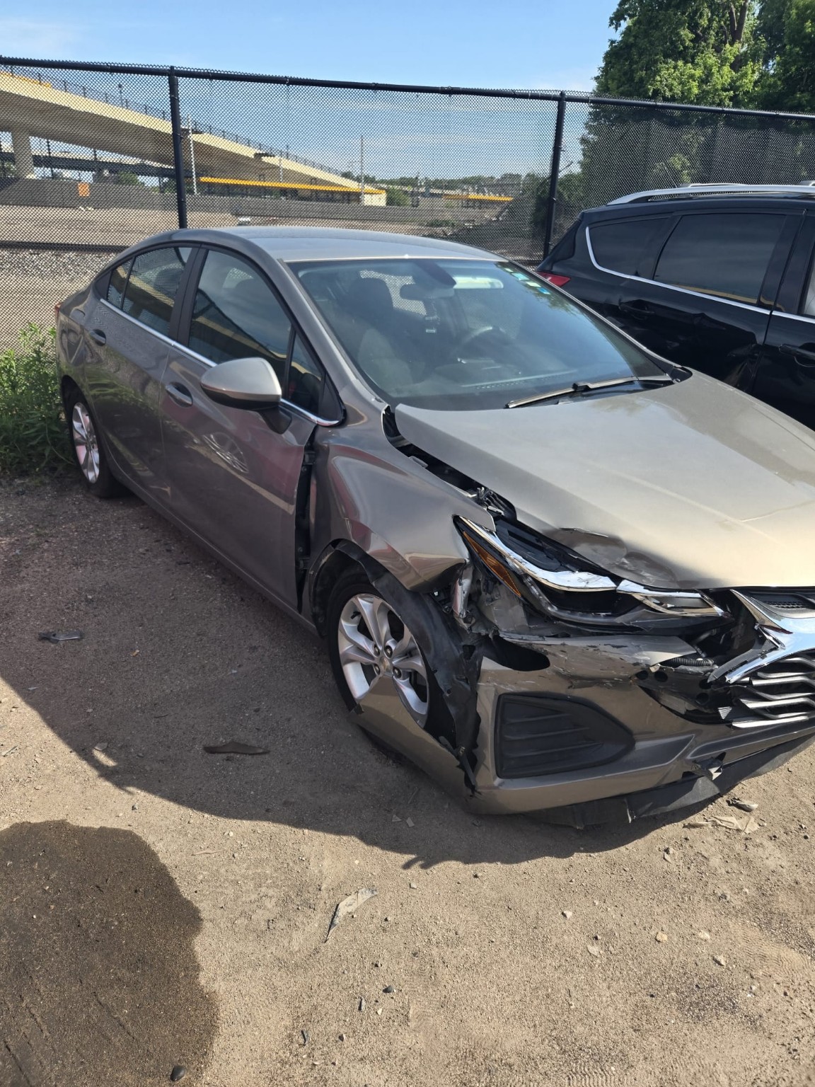 Vehicle with major front-end collision damage before repair
